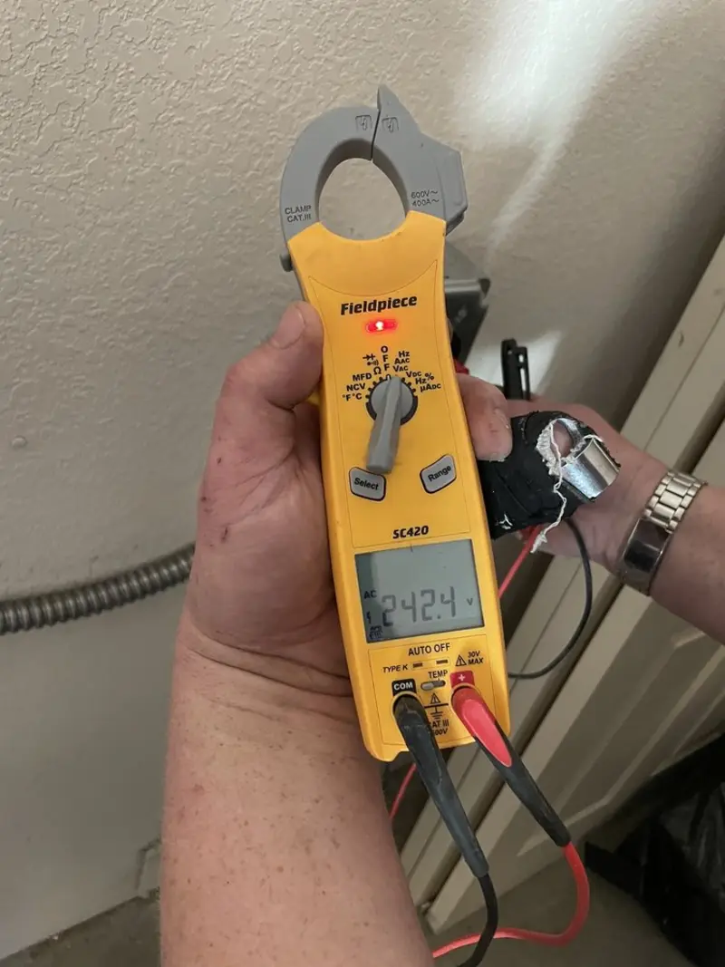 Voltage testing with clamp meter during Electrical Installation Services in Cahokia Heights